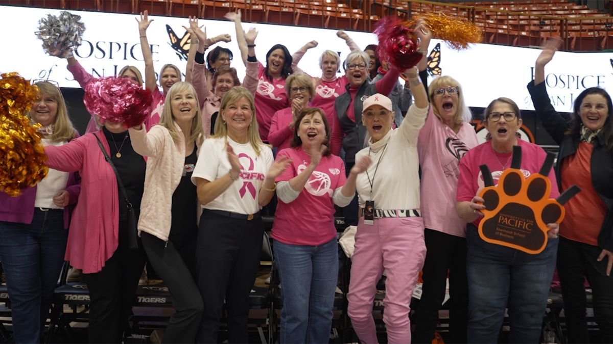First Lady Jean Callahan with other women leaders at a women's basketball game. 